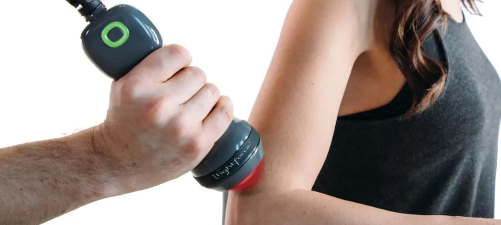 lightforce laser used on woman's elbow