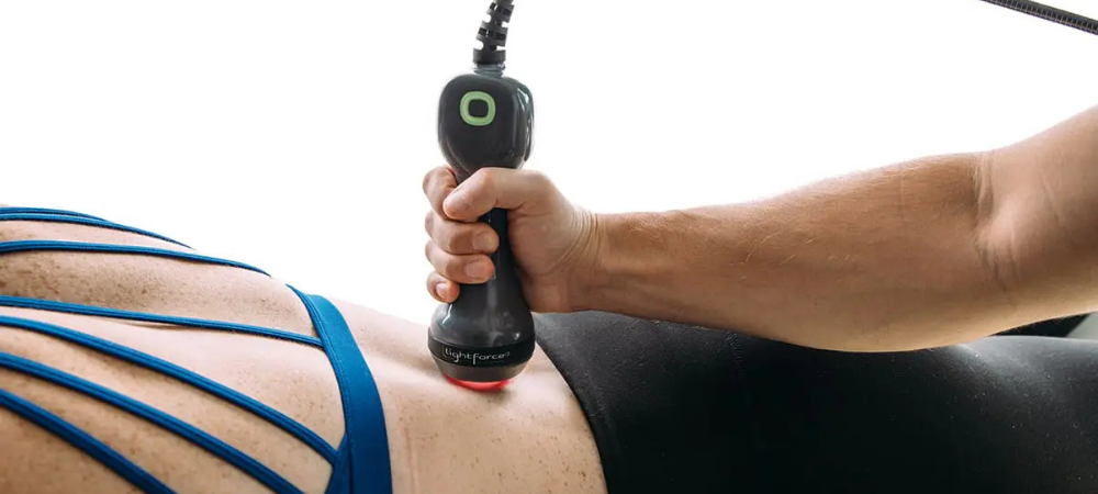 lightforce laser used on patient lower back