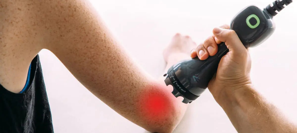 laser applied to patient elbow