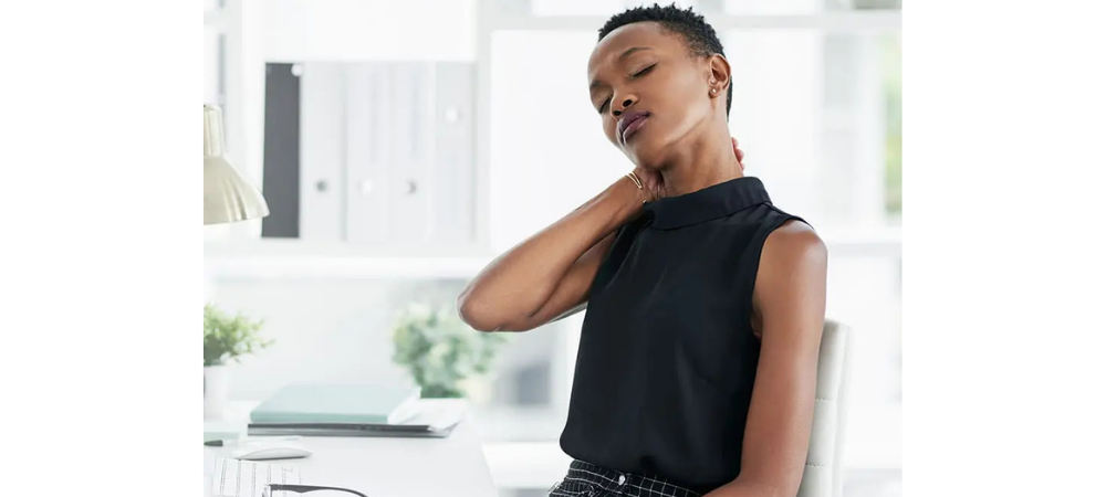 woman rubbing her neck