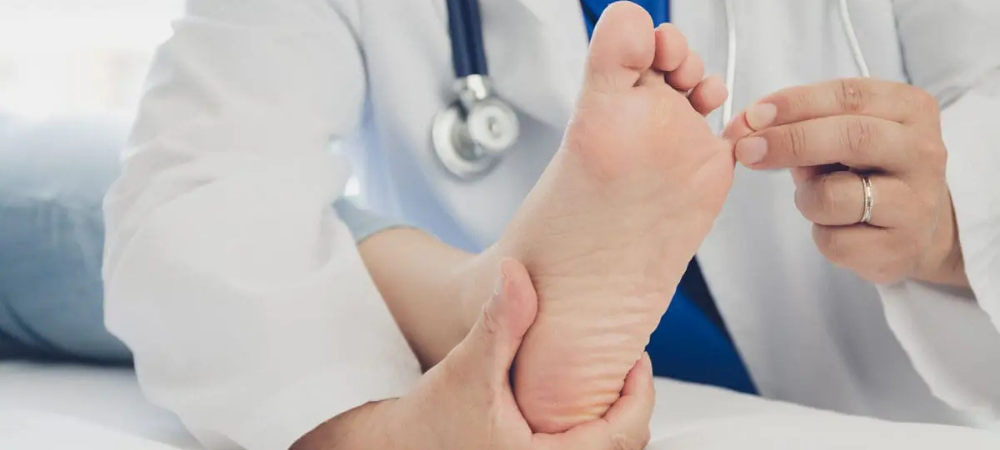 doctor treating patient with foot pain