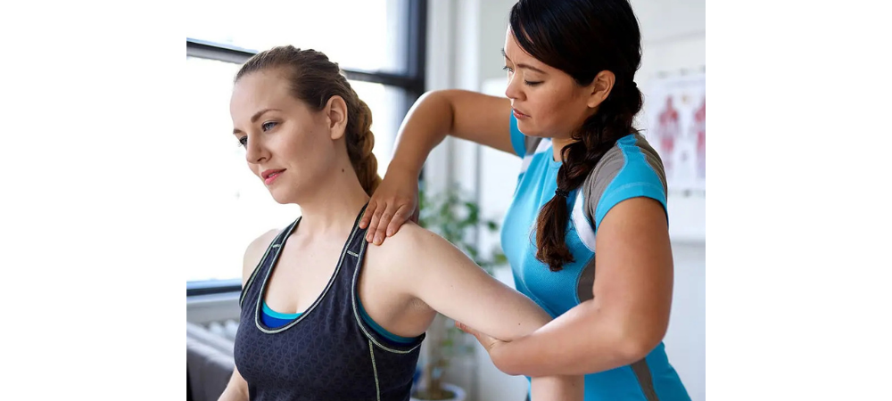 clinician moving patient arm
