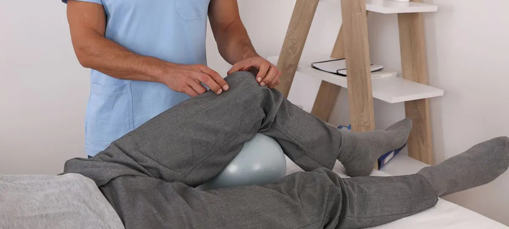 doctor observing patient with knee pain