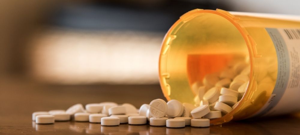 bottle of pills spilled over