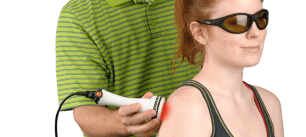 clinician using laser on patient shoulder