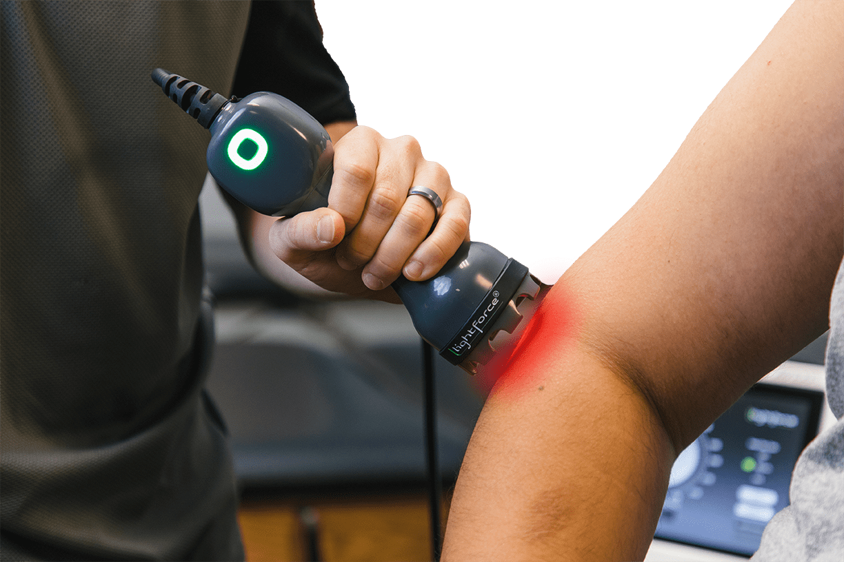 lightforce laser used on patient elbow
